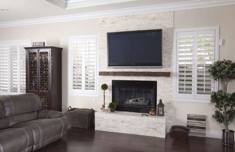 White plantation shutters in a Orlando living room with solid hardwood floors.